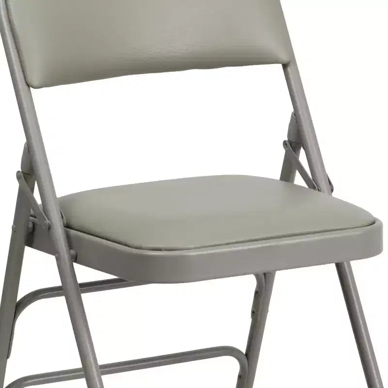 Chaise pliante en métal rembourrée série HERCULES à triple renfort et double charnière