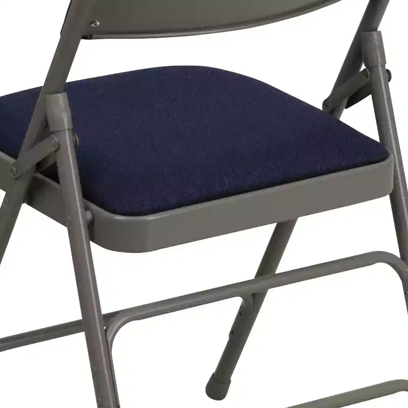 Chaise pliante en métal rembourrée série HERCULES à triple renfort et double charnière