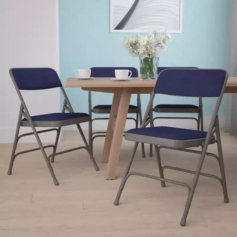 Chaise pliante en métal rembourrée série HERCULES à triple renfort et double charnière